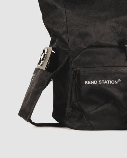 Close-up of the Send Station Bucket phone sleeve and zipped front pocket