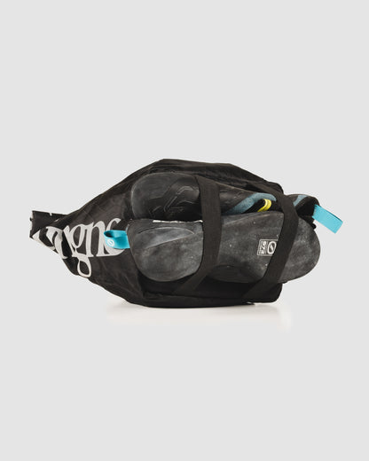 Send Station Bucket packed with climbing shoes, rope and brushes, seen from above