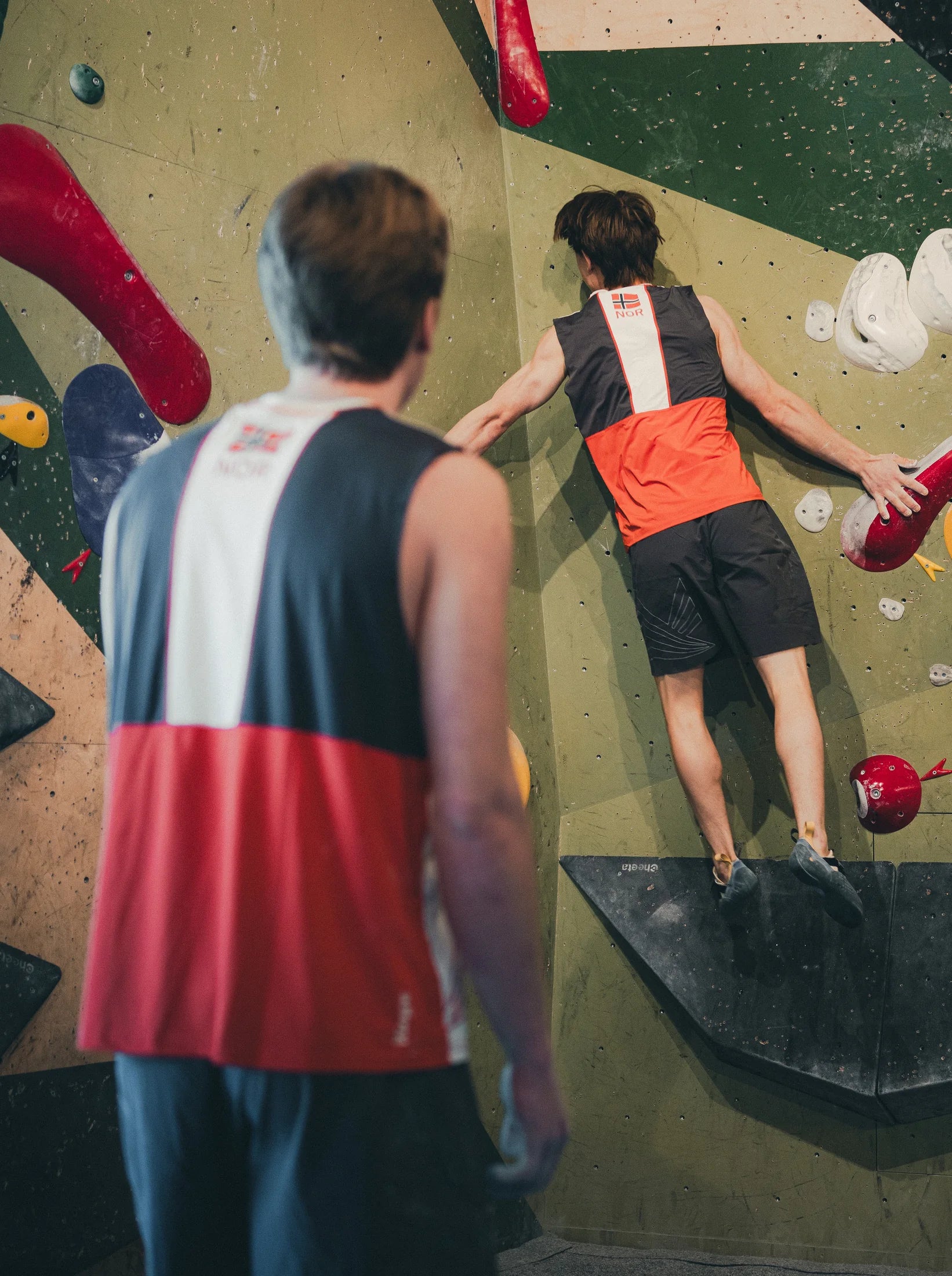 Two Norwegian national-team athletes use the Performance collection on the bouldering wall at Gneiss.